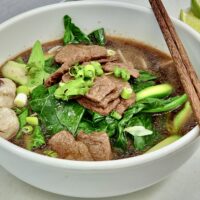 bowl of noodle soup and vegetables