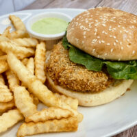vegan chicken burger with fries on a plate