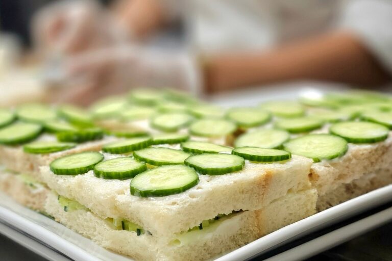 cucumber sandwiches on a prep table