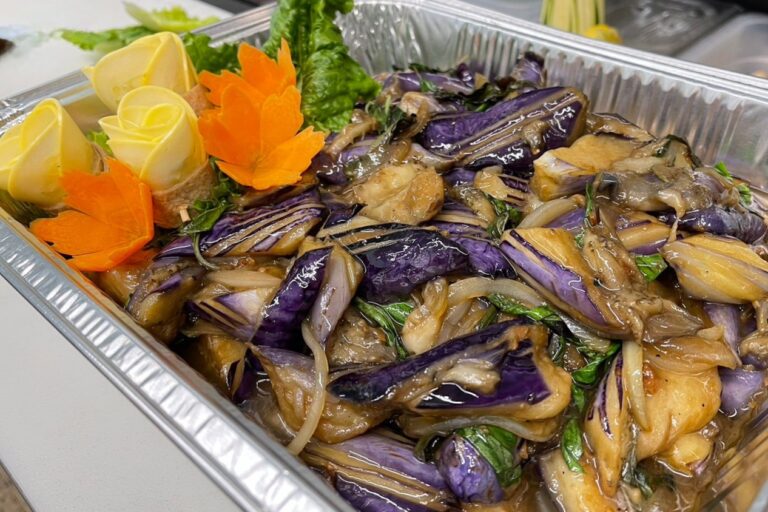 cooked eggplants in a foil tray