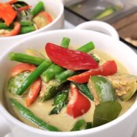 green and vegetable curry in a bowl