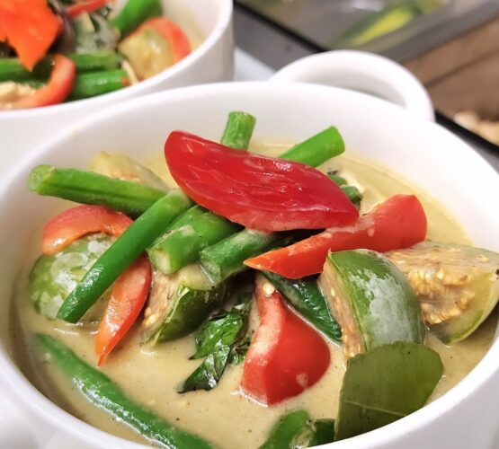 green and vegetable curry in a bowl
