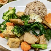 mixed vegetables and rice on a plate