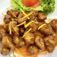 orange chicken nuggets on a plate