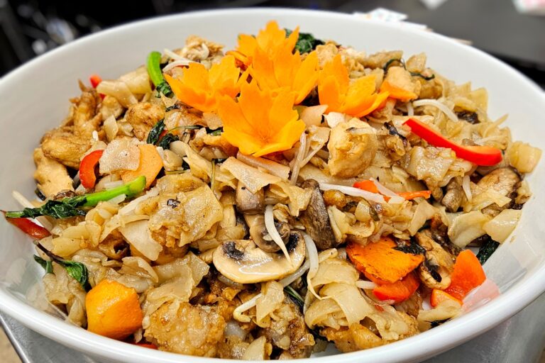 cooked rice noodles in a large white bowl