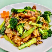 rice noodle and broccoli on a plate