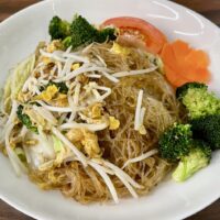 rice noodle and broccoli on a plate