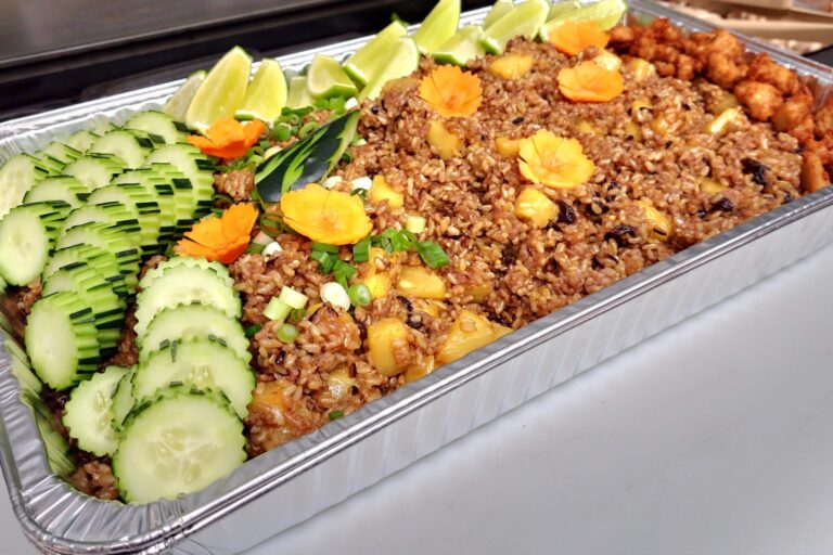 fried rice in a large aluminum tray