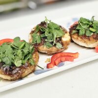 eggs topped with sauce and cilantro